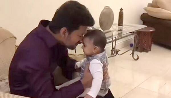 Vijay playing with child